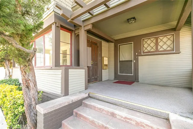 a view of a house with a yard and sitting area