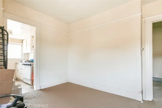 a view of walk in closet and bathroom