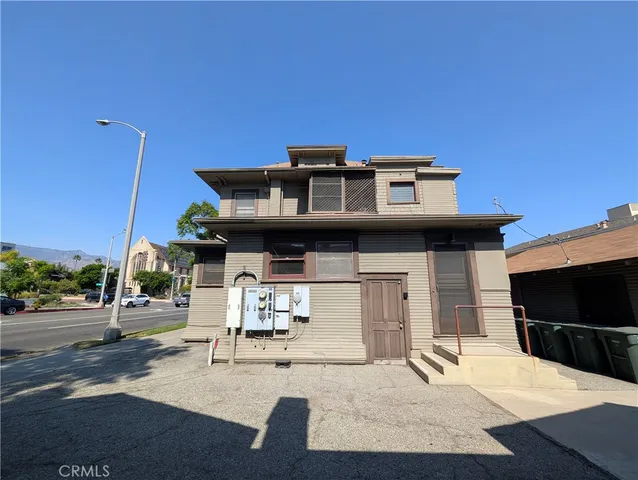 a view of a house with a flower garden