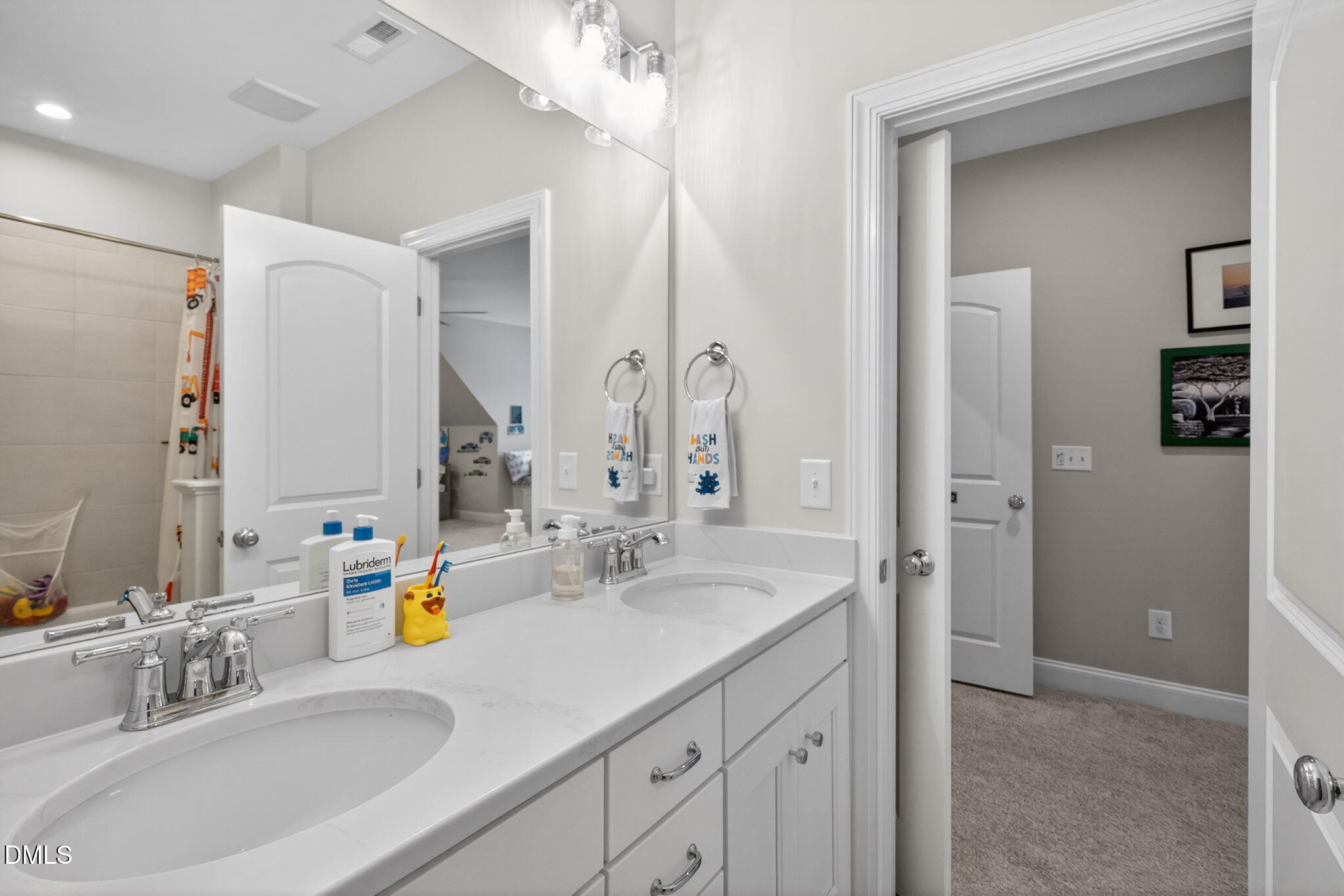 6901 Ray Family Farm Court Raleigh, NC 27613 - Photo 37 of 52 a bathroom with a sink and a mirror