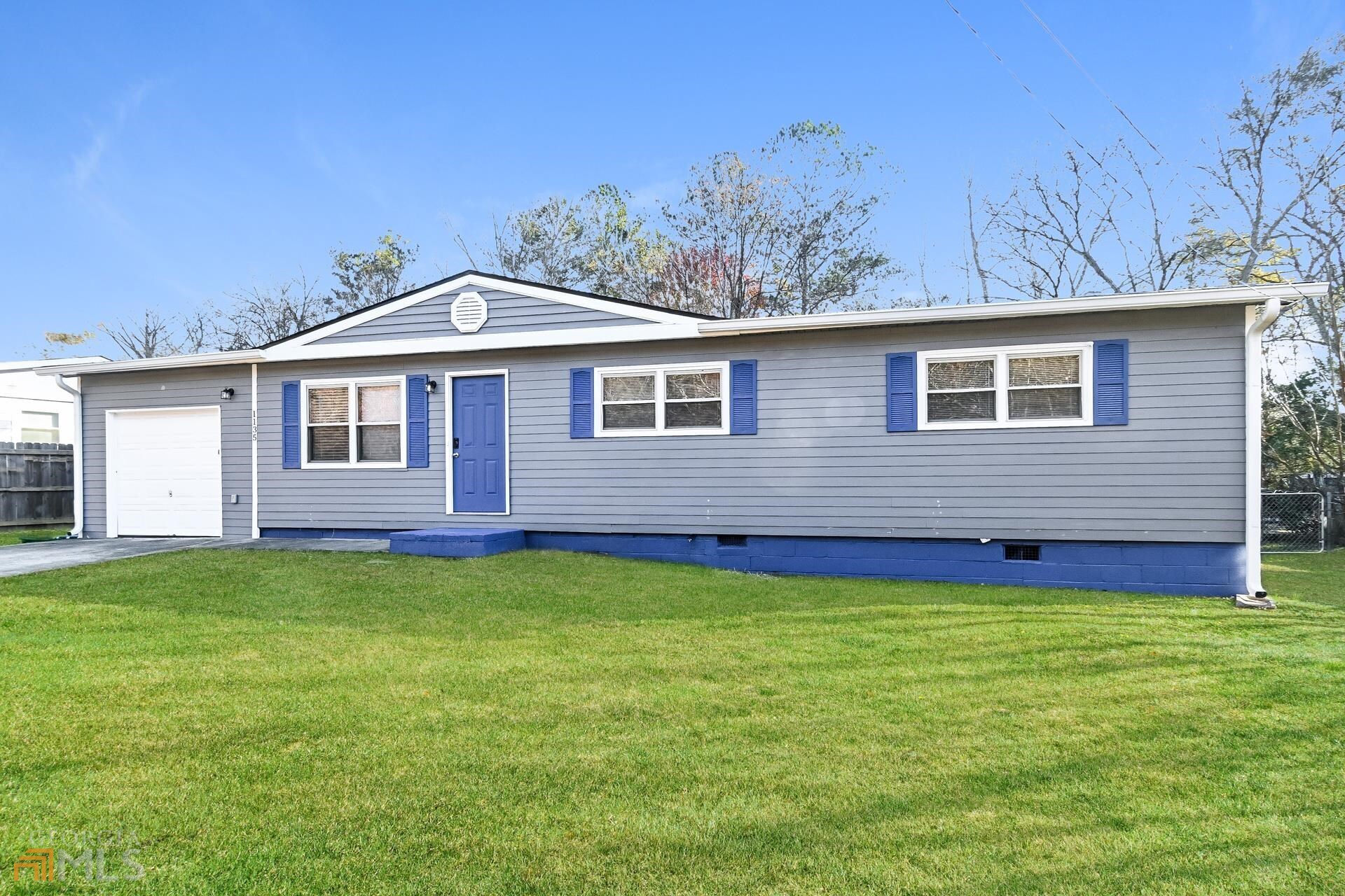 1135 Pontiac Circle Austell, GA 30168 - Photo 1 of 1 a front view of a house with a garden and yard