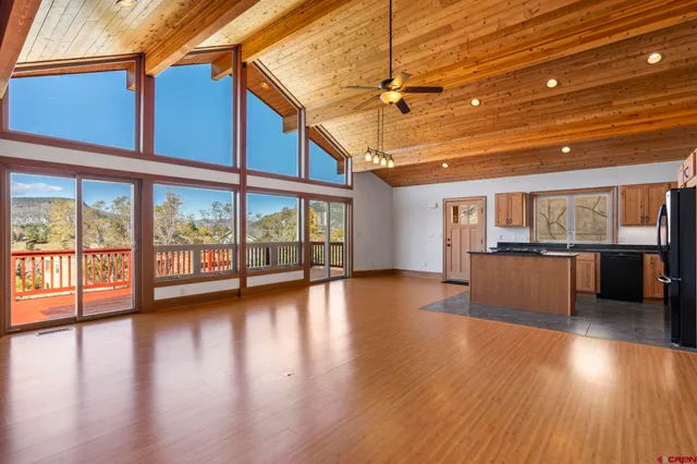 a view of kitchen with furniture and wooden floor