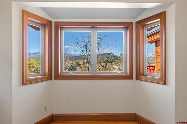 a view of a room that has a window in it