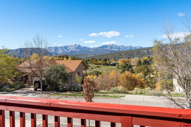 a view of a park with large trees