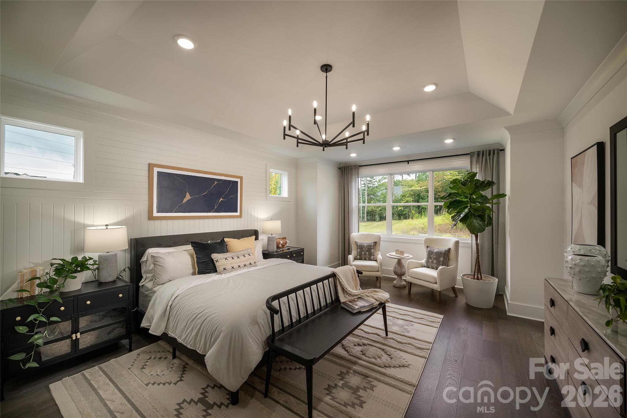 10934 Old Ravine Trail Huntersville, NC 28078 - Photo 6 of 13 a bedroom with a large bed and a chandelier