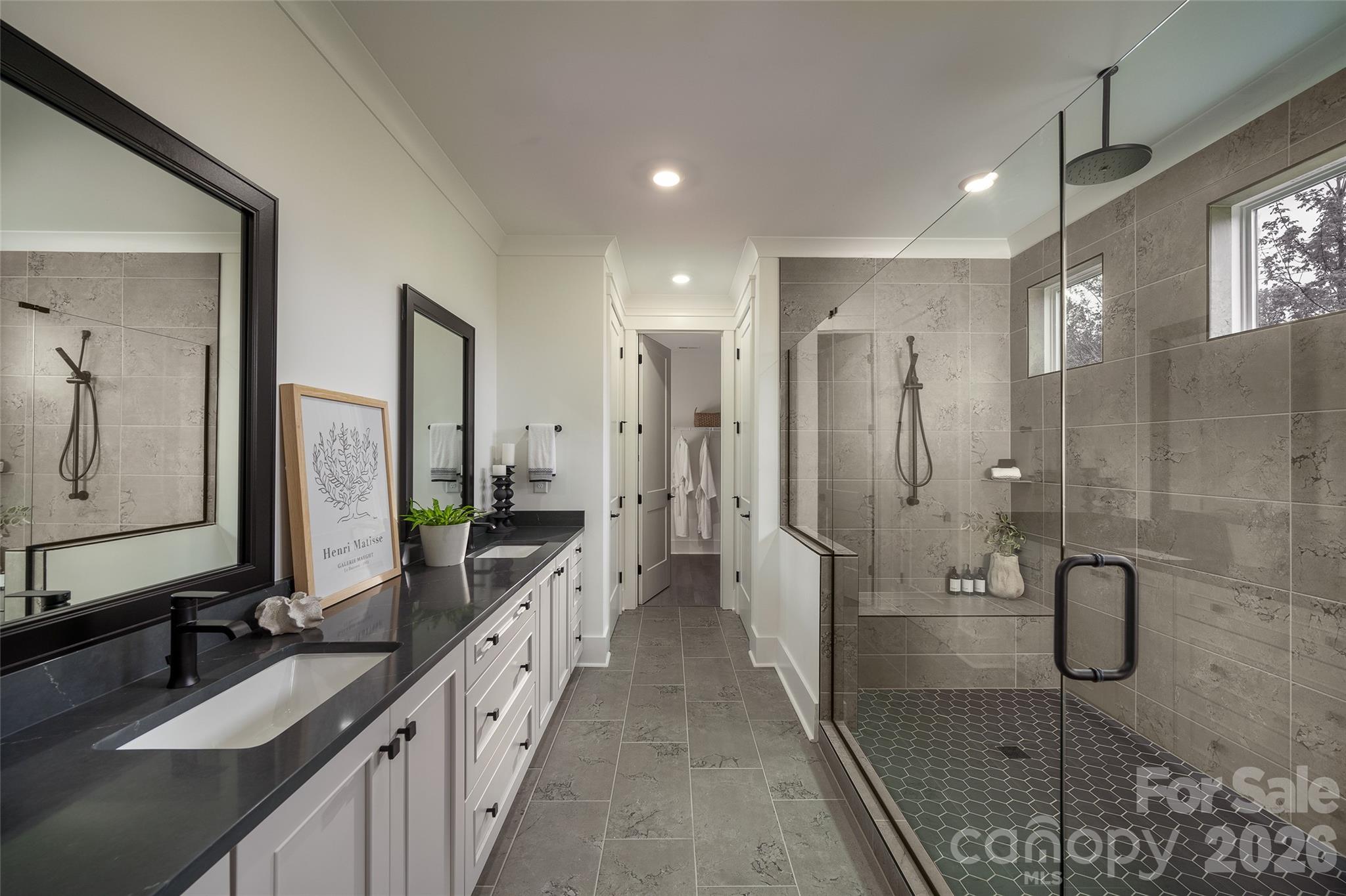 10934 Old Ravine Trail Huntersville, NC 28078 - Photo 7 of 13 a bathroom with a double vanity sink mirror and shower