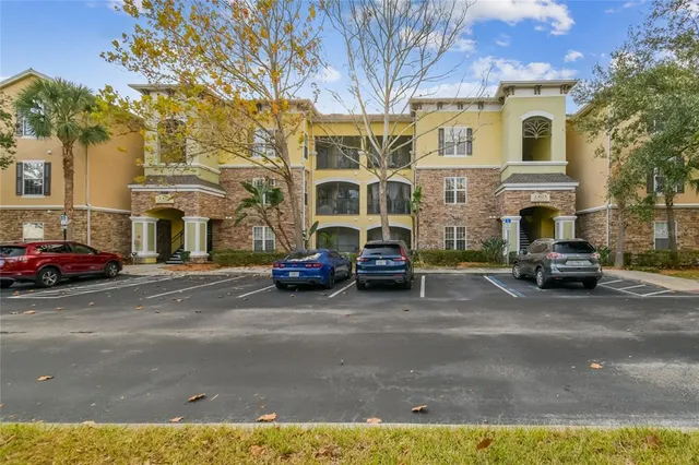 a couple of cars parked in front of a house