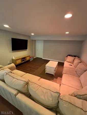 a living room with a couch and a flat screen tv