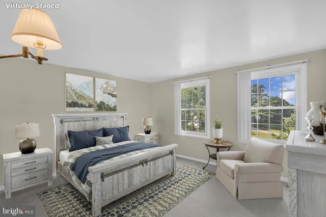 a bedroom with a bed and a couch