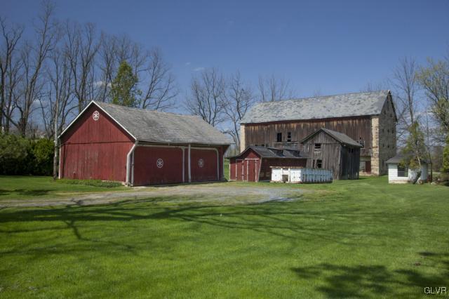 5123 Chapmans Road Orefield, PA 18069 - Photo 3 of 11 a front view of a house with a yard and garage