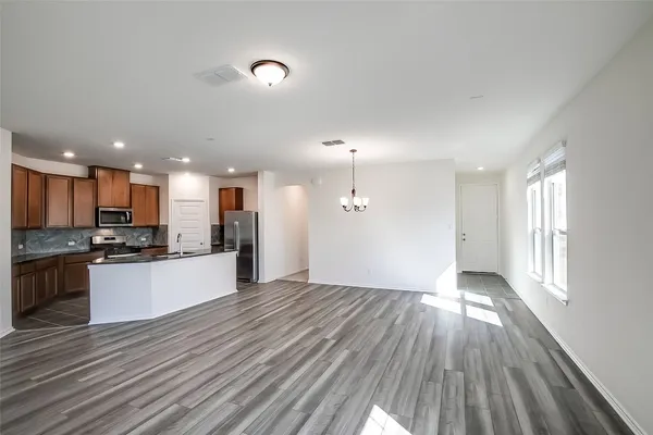 a view of kitchen with wooden floor