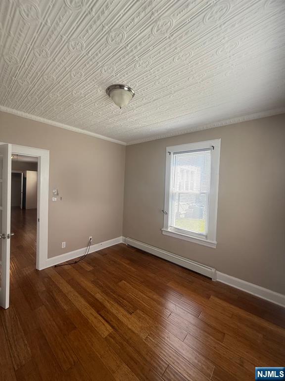 59 Union Avenue, Unit 3 North Arlington, NJ 07031 - Photo 12 of 15 a view of an empty room with wooden floor and a window
