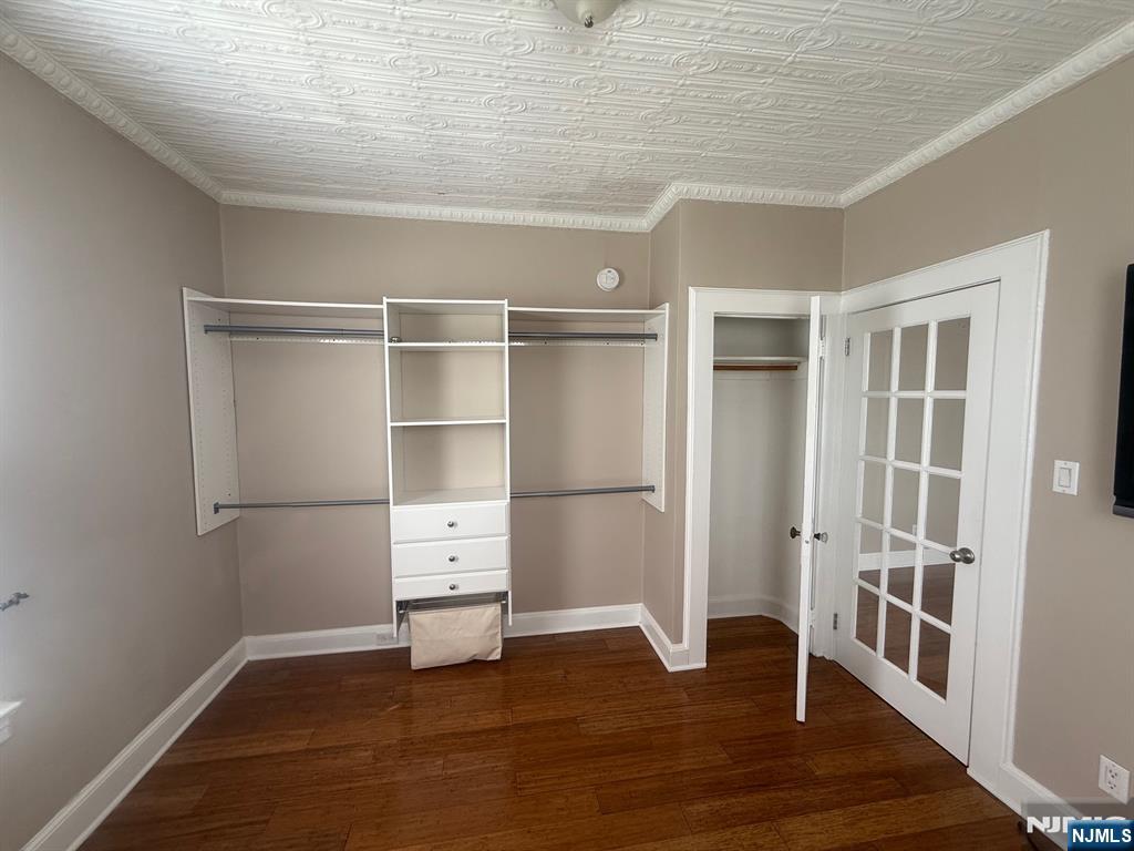 59 Union Avenue, Unit 3 North Arlington, NJ 07031 - Photo 13 of 15 a view of an empty room with a window and wooden floor
