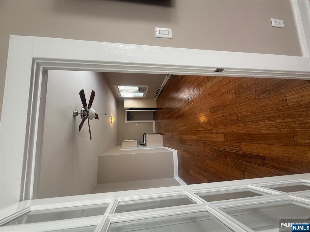 59 Union Avenue, Unit 3 North Arlington, NJ 07031 - Photo 15 of 15 a view of a livingroom with a ceiling fan and wooden floor