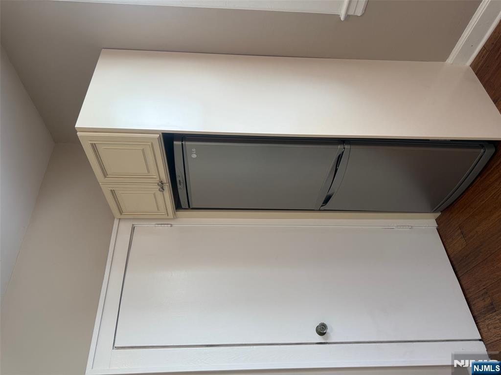 59 Union Avenue, Unit 3 North Arlington, NJ 07031 - Photo 3 of 15 a view of walk in closet with wooden floor