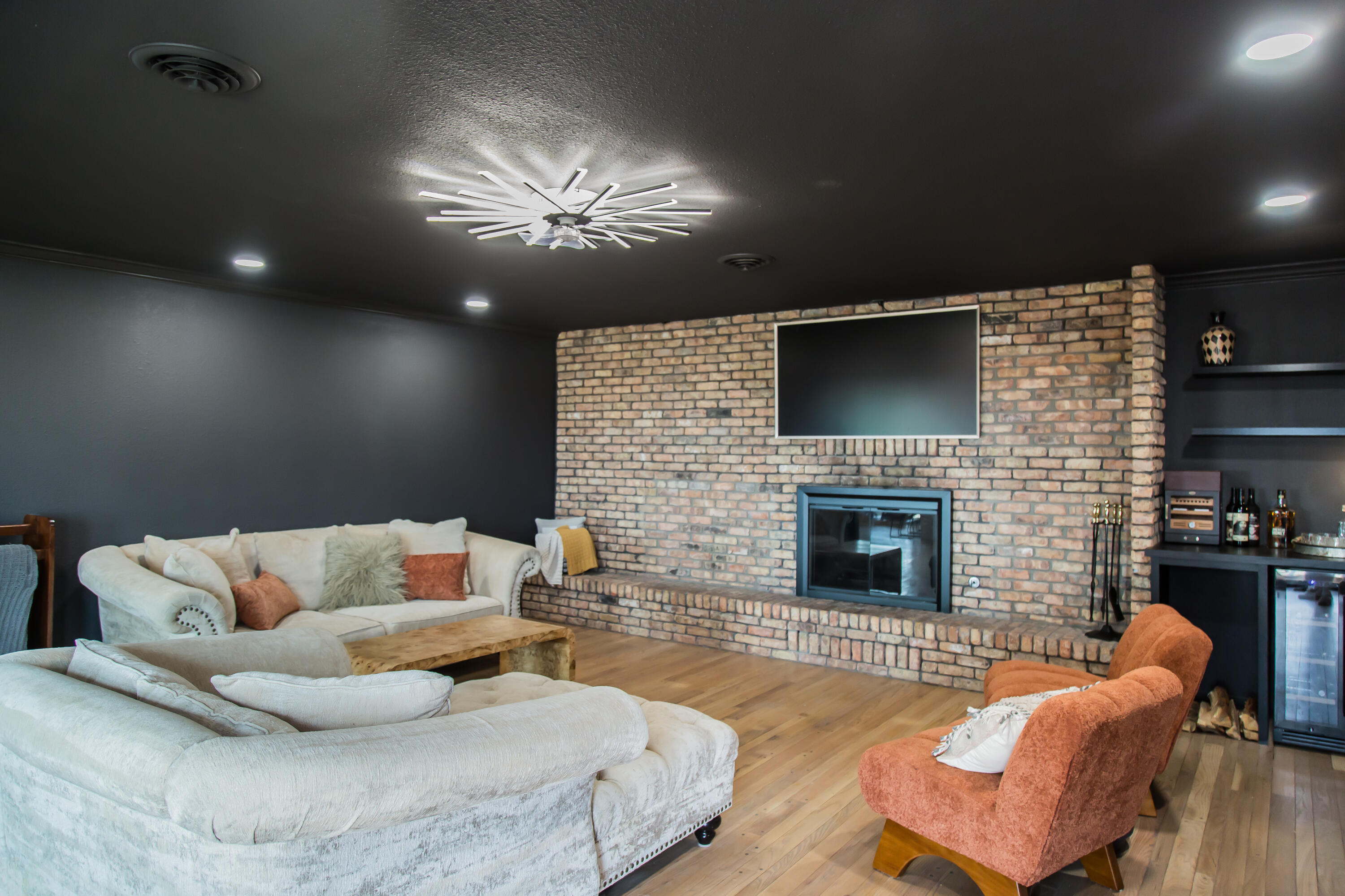 930 Sun Road Plainview, TX 79072 - Photo 17 of 22 a living room with furniture and a fireplace