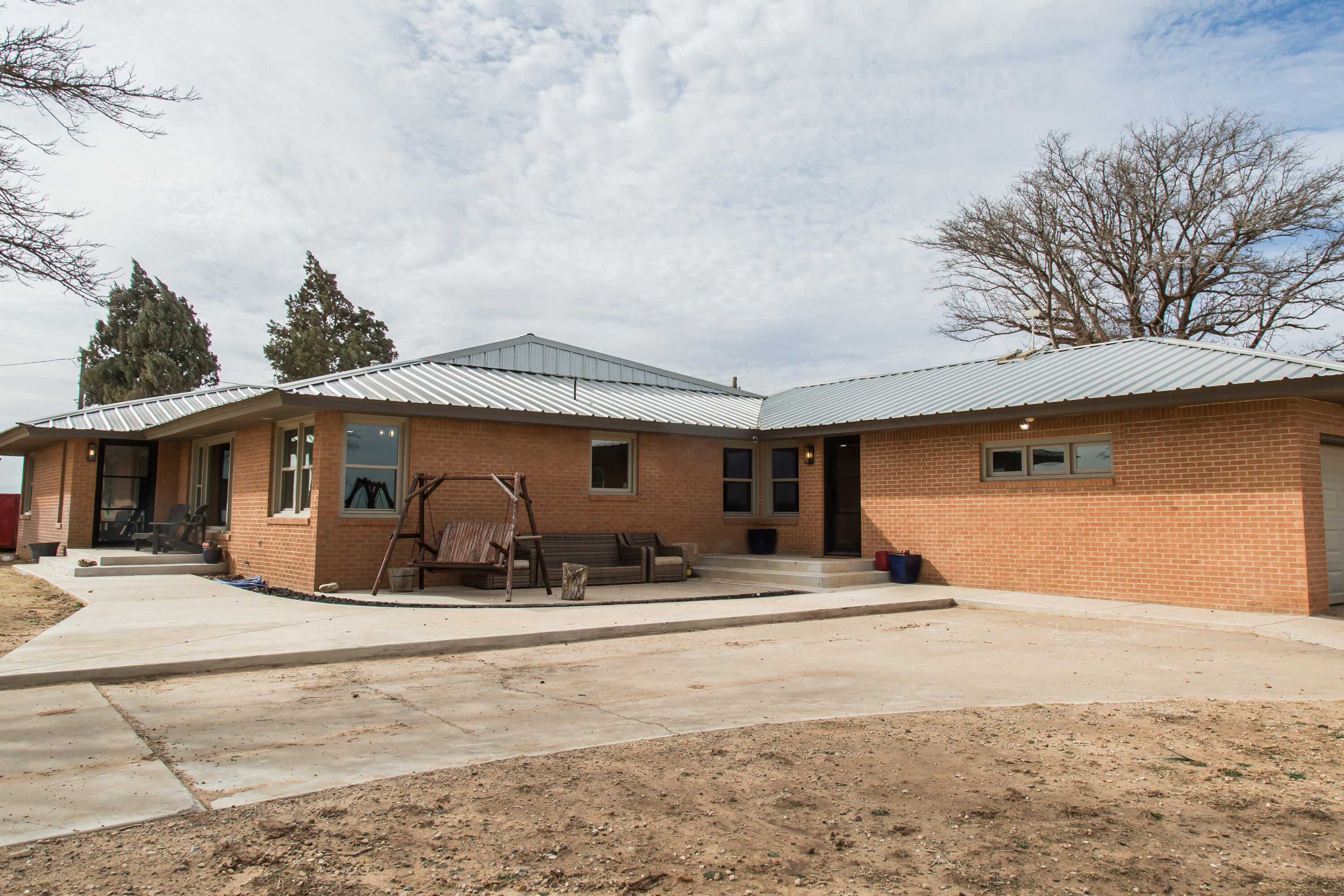 930 Sun Road Plainview, TX 79072 - Photo 18 of 22 a house with trees in the background