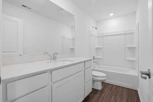 a picture of a bathroom with a shower