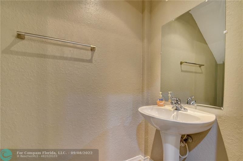 4375 Emerald Vista Lake Worth Beach, FL 33461 - Photo 12 of 27 a bathroom with a sink and a mirror