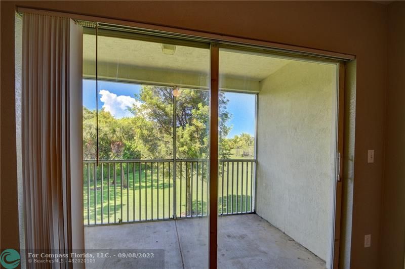 4375 Emerald Vista Lake Worth Beach, FL 33461 - Photo 16 of 27 a view of a room with large windows