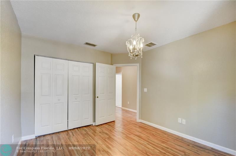 4375 Emerald Vista Lake Worth Beach, FL 33461 - Photo 20 of 27 a view of empty room with wooden floor