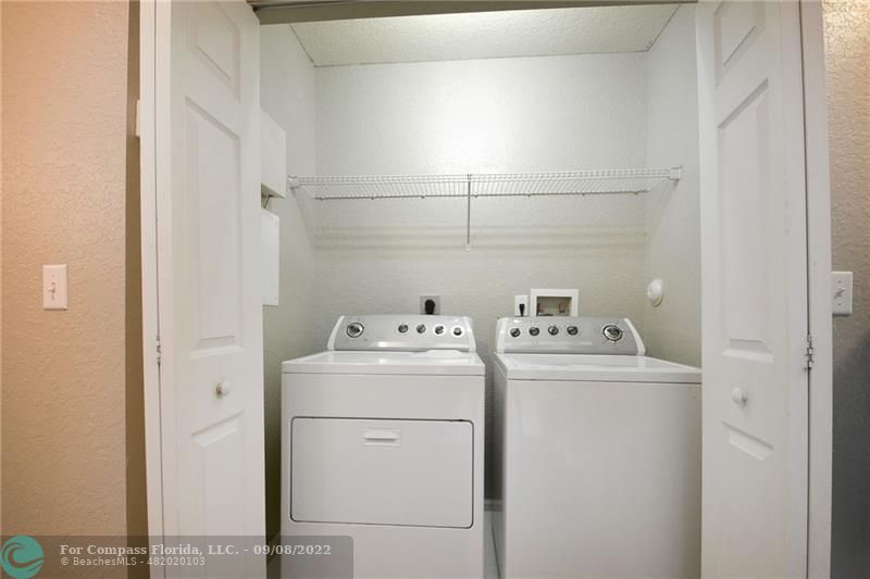 4375 Emerald Vista Lake Worth Beach, FL 33461 - Photo 24 of 27 a utility room with dryer and washer