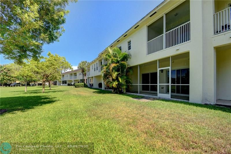 4375 Emerald Vista Lake Worth Beach, FL 33461 - Photo 26 of 27 a view of a house with a yard