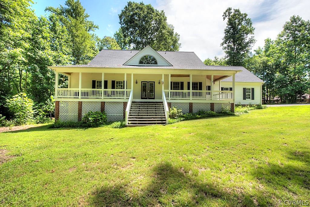 9217 Varina Road Henrico, VA 23231 - Photo 1 of 49 a front view of a house with a yard