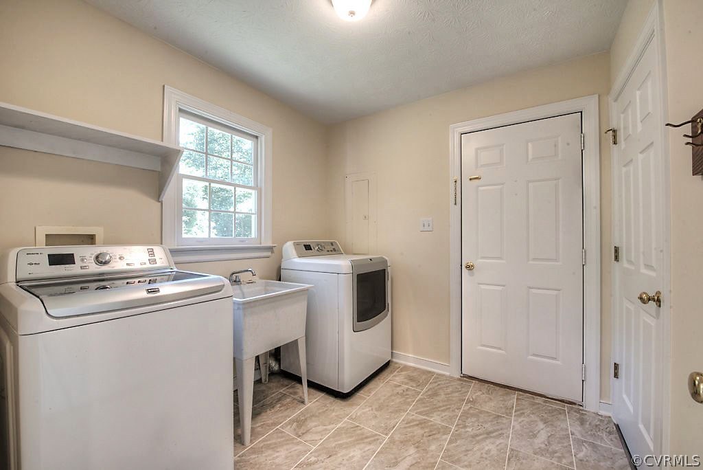 9217 Varina Road Henrico, VA 23231 - Photo 23 of 49 a utility room with dryer and washer
