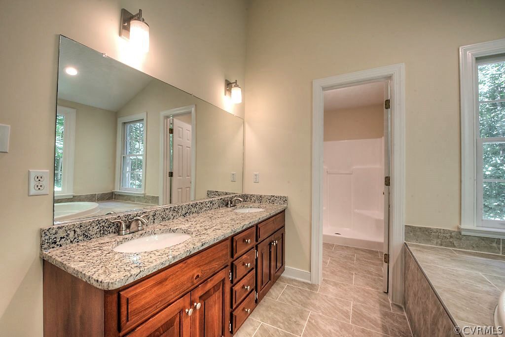 9217 Varina Road Henrico, VA 23231 - Photo 30 of 49 a bathroom with a granite countertop sink and a mirror