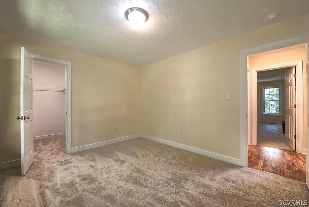 9217 Varina Road Henrico, VA 23231 - Photo 33 of 49 an empty room with closet and mirror