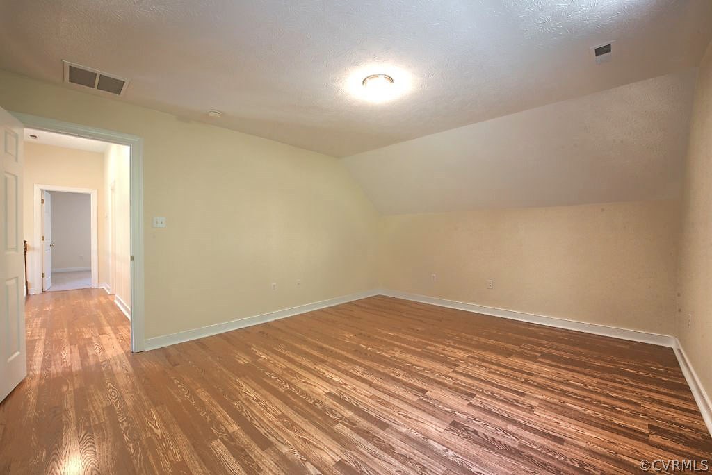 9217 Varina Road Henrico, VA 23231 - Photo 35 of 49 a view of empty room with wooden floor