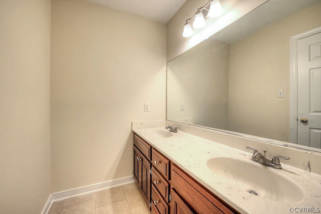 9217 Varina Road Henrico, VA 23231 - Photo 36 of 49 a bathroom with a sink and a mirror