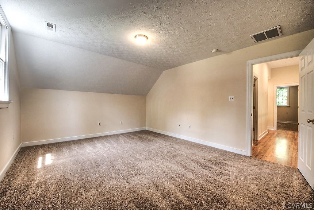 9217 Varina Road Henrico, VA 23231 - Photo 38 of 49 an empty room with wooden floor and windows