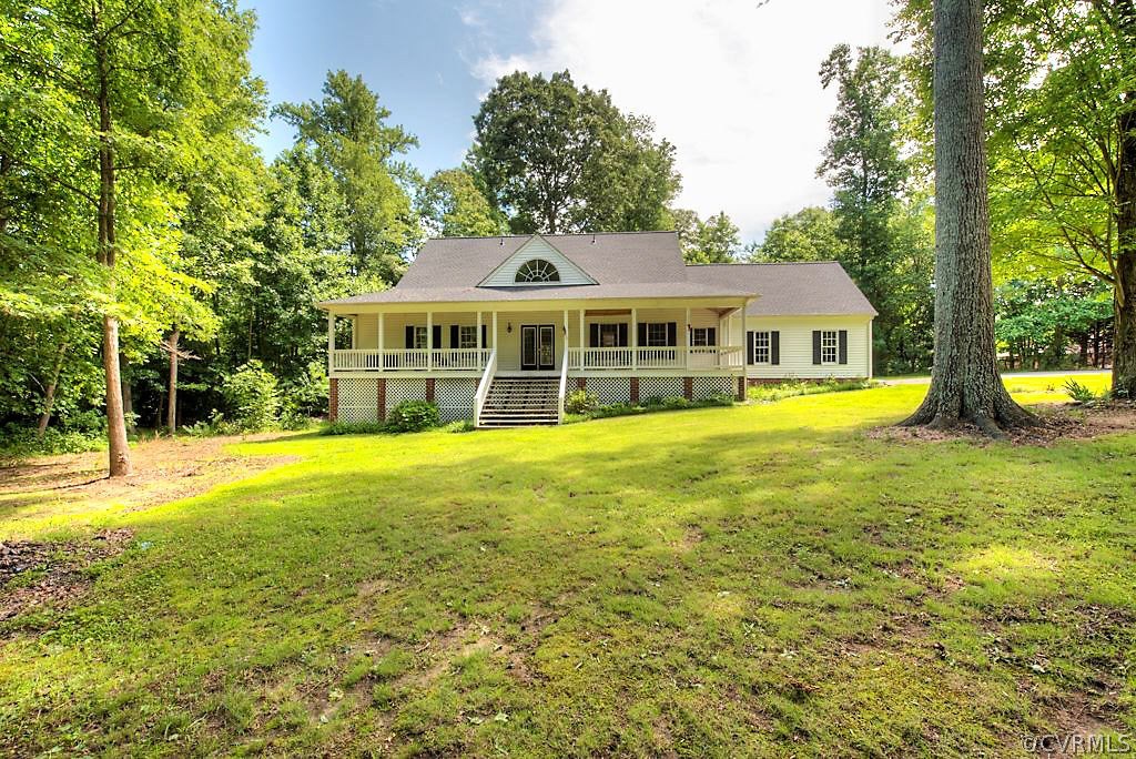 9217 Varina Road Henrico, VA 23231 - Photo 48 of 49 a view of a house with a big yard and palm trees