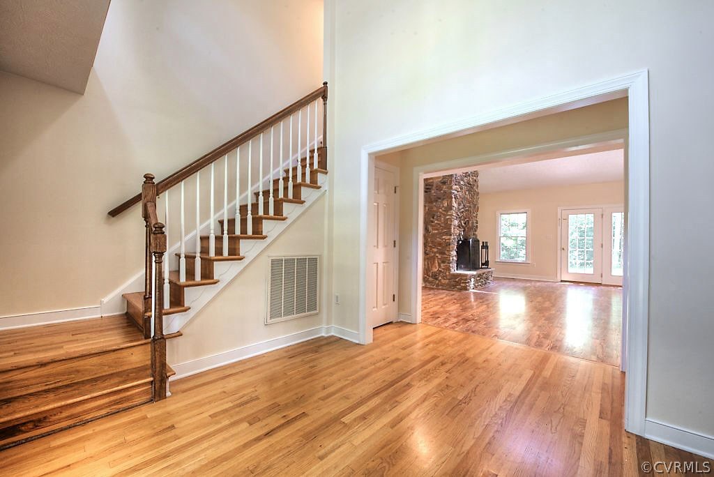 9217 Varina Road Henrico, VA 23231 - Photo 5 of 49 a view of a hallway view with wooden floor and staircase