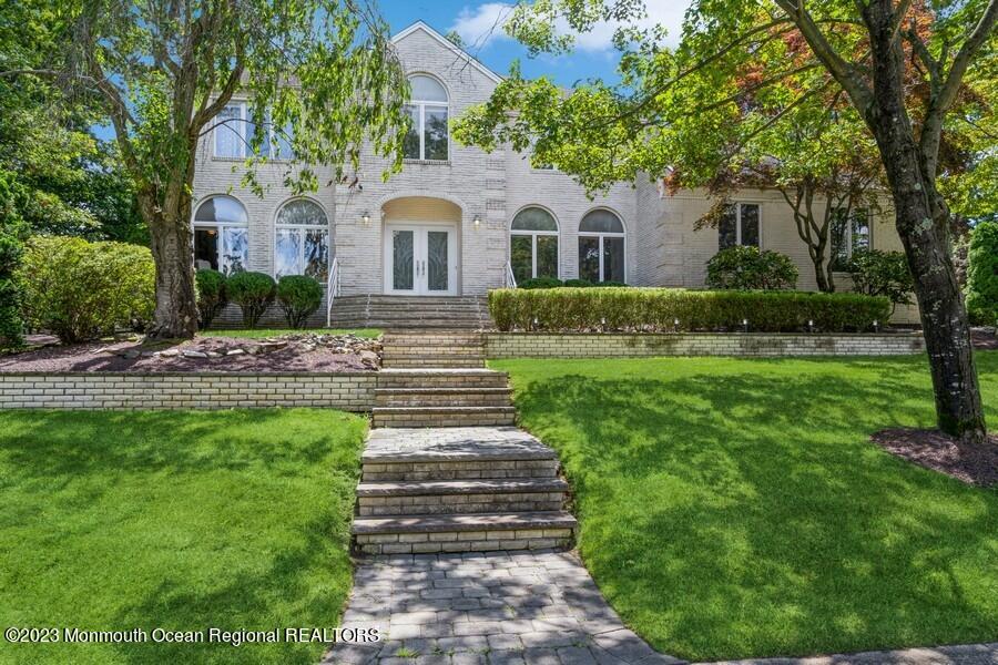 30 Chagall Road Marlboro, NJ 07746 - Photo 1 of 26 a view of a white house with a yard and large tree