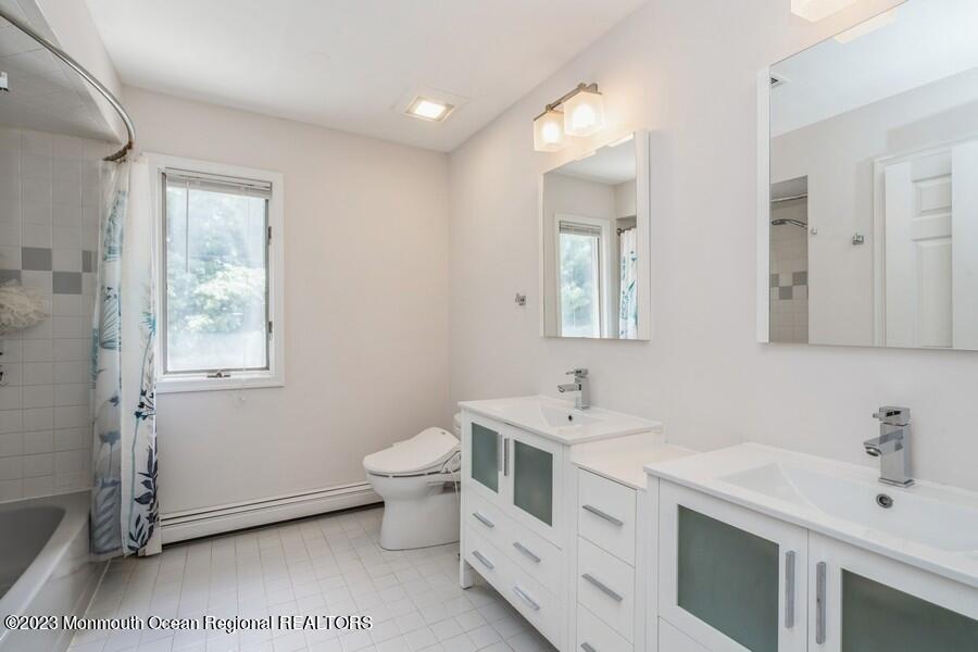30 Chagall Road Marlboro, NJ 07746 - Photo 20 of 26 a spacious bathroom with a double vanity sink mirror and toilet