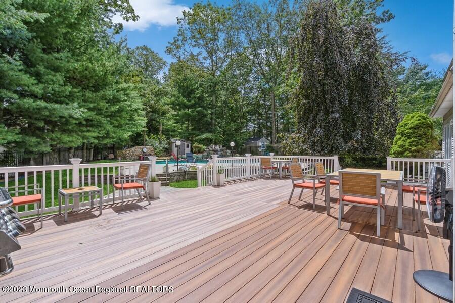 30 Chagall Road Marlboro, NJ 07746 - Photo 23 of 26 a view of a chairs and table on the wooden deck