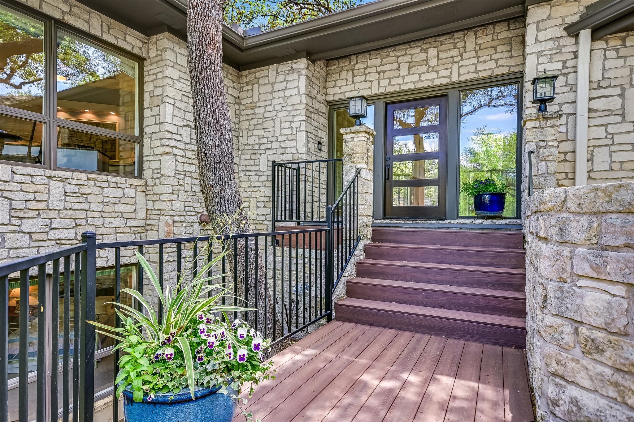 3901 Prentice Lane Austin, TX 78746 - Photo 3 of 40 A welcoming front entry is framed by natural landscaping that blends beautifully with the wooded setting.
