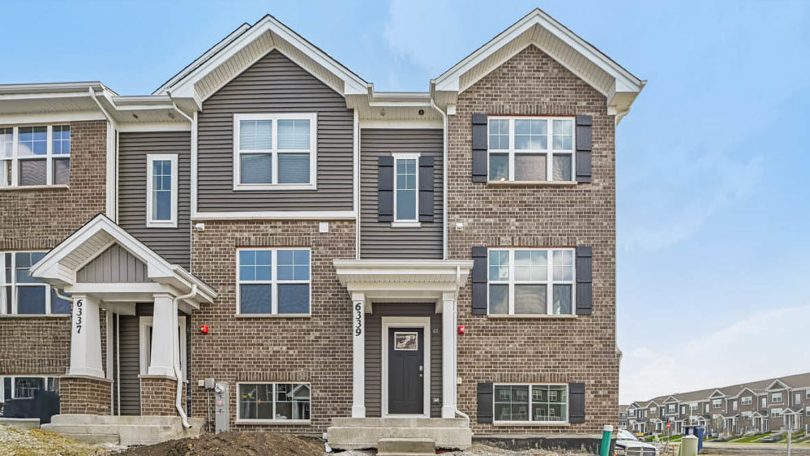 17305 Ulster Drive Tinley Park, IL 60477 - Photo 1 of 25 a front view of a house with a yard