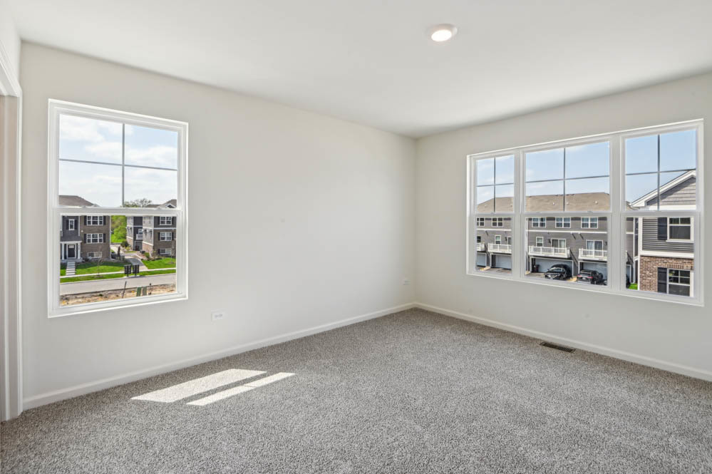17305 Ulster Drive Tinley Park, IL 60477 - Photo 12 of 25 an empty room with windows