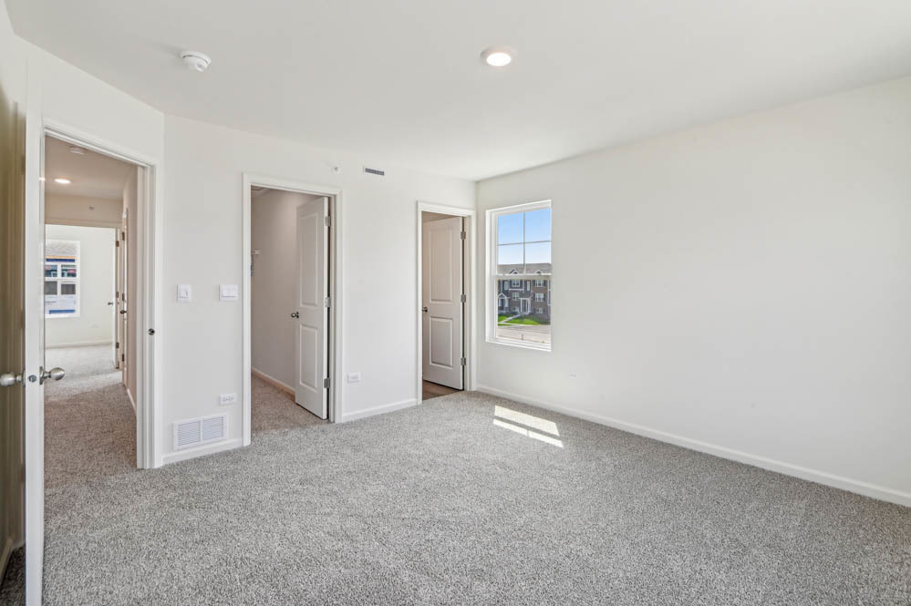 17305 Ulster Drive Tinley Park, IL 60477 - Photo 14 of 25 an empty room with windows