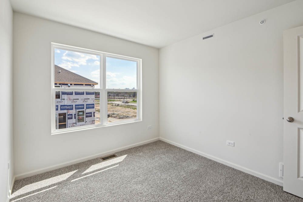 17305 Ulster Drive Tinley Park, IL 60477 - Photo 19 of 25 a view of an empty room with a window