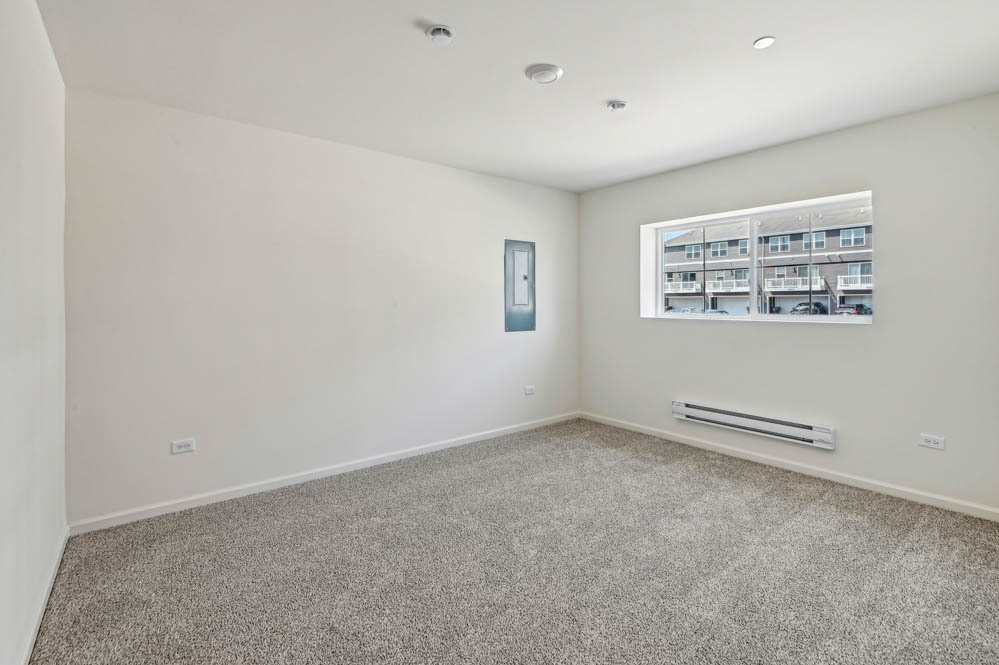 17305 Ulster Drive Tinley Park, IL 60477 - Photo 24 of 25 an empty room with a empty space and a window