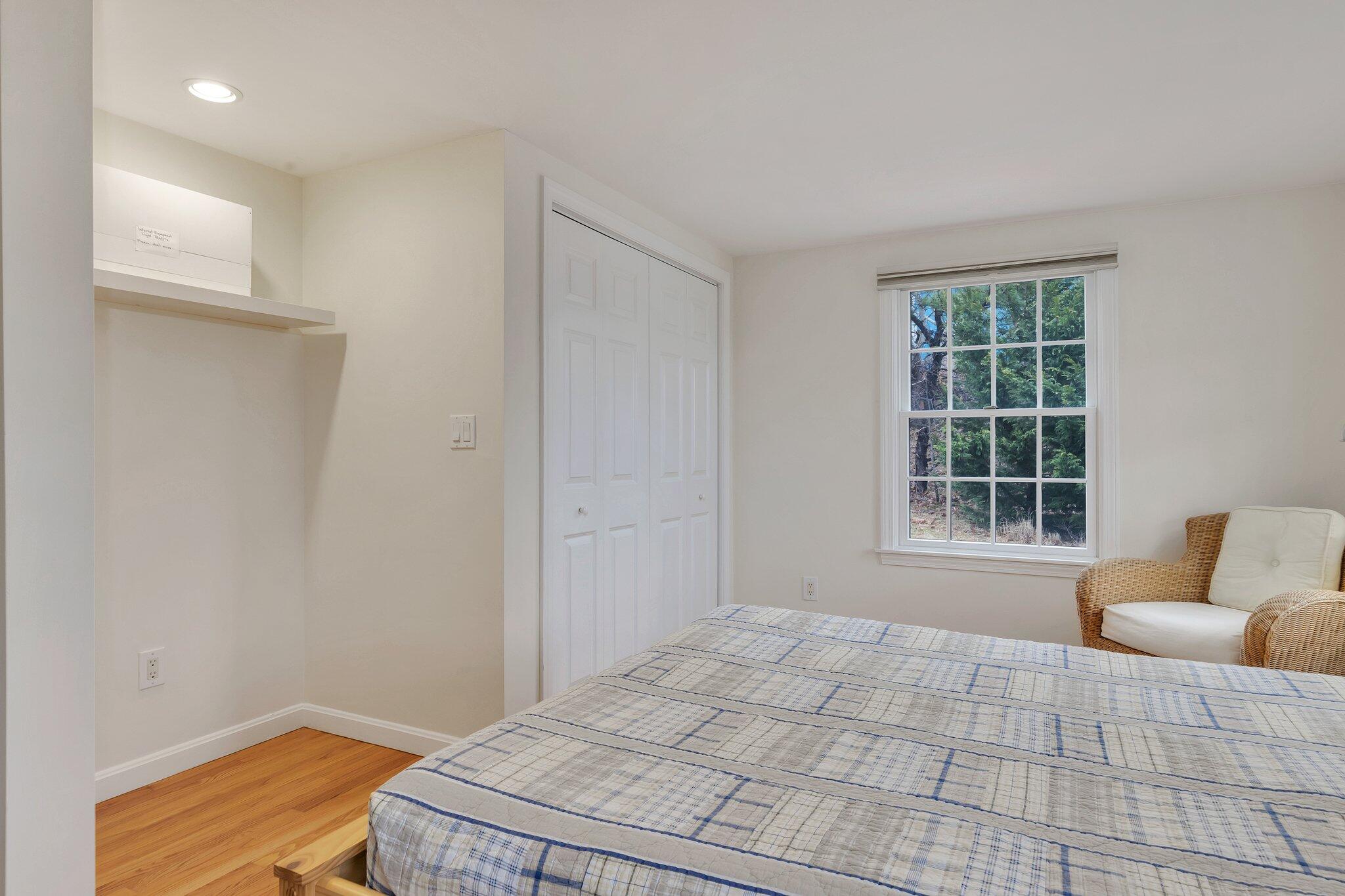 6 Shore Road, Unit 26 Truro, MA 02666 - Photo 14 of 25 a bedroom with a bed and a window with outer view