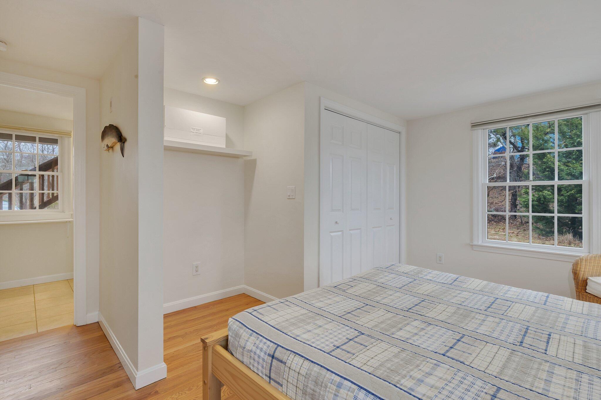 6 Shore Road, Unit 26 Truro, MA 02666 - Photo 15 of 25 a bedroom with a bed and a window
