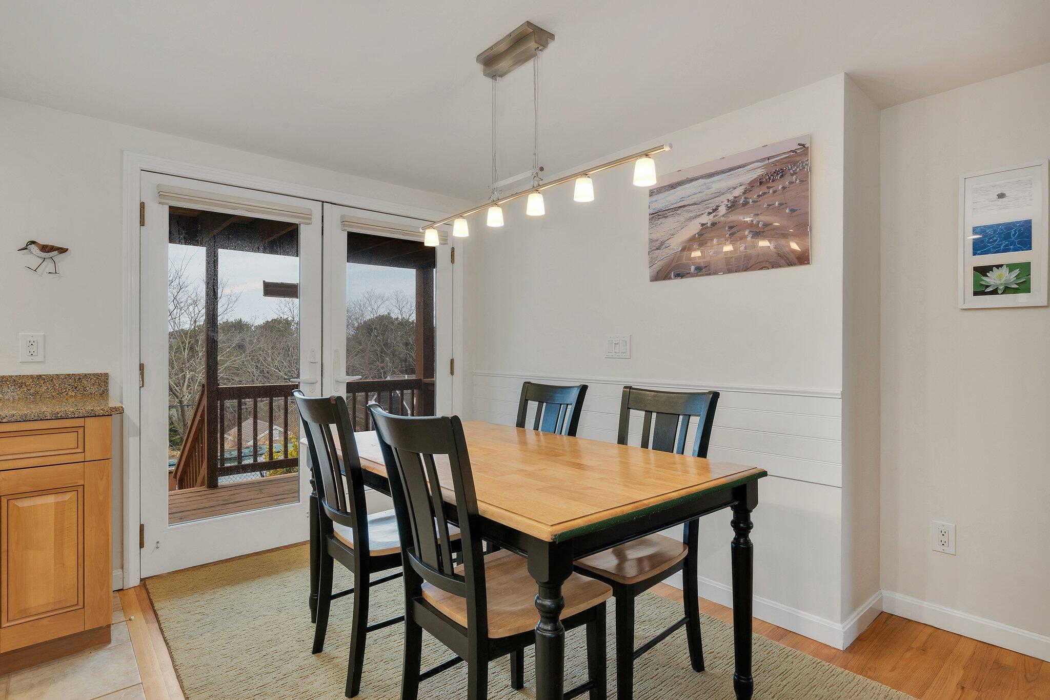 6 Shore Road, Unit 26 Truro, MA 02666 - Photo 7 of 25 a view of a dining room with furniture window and wooden floor