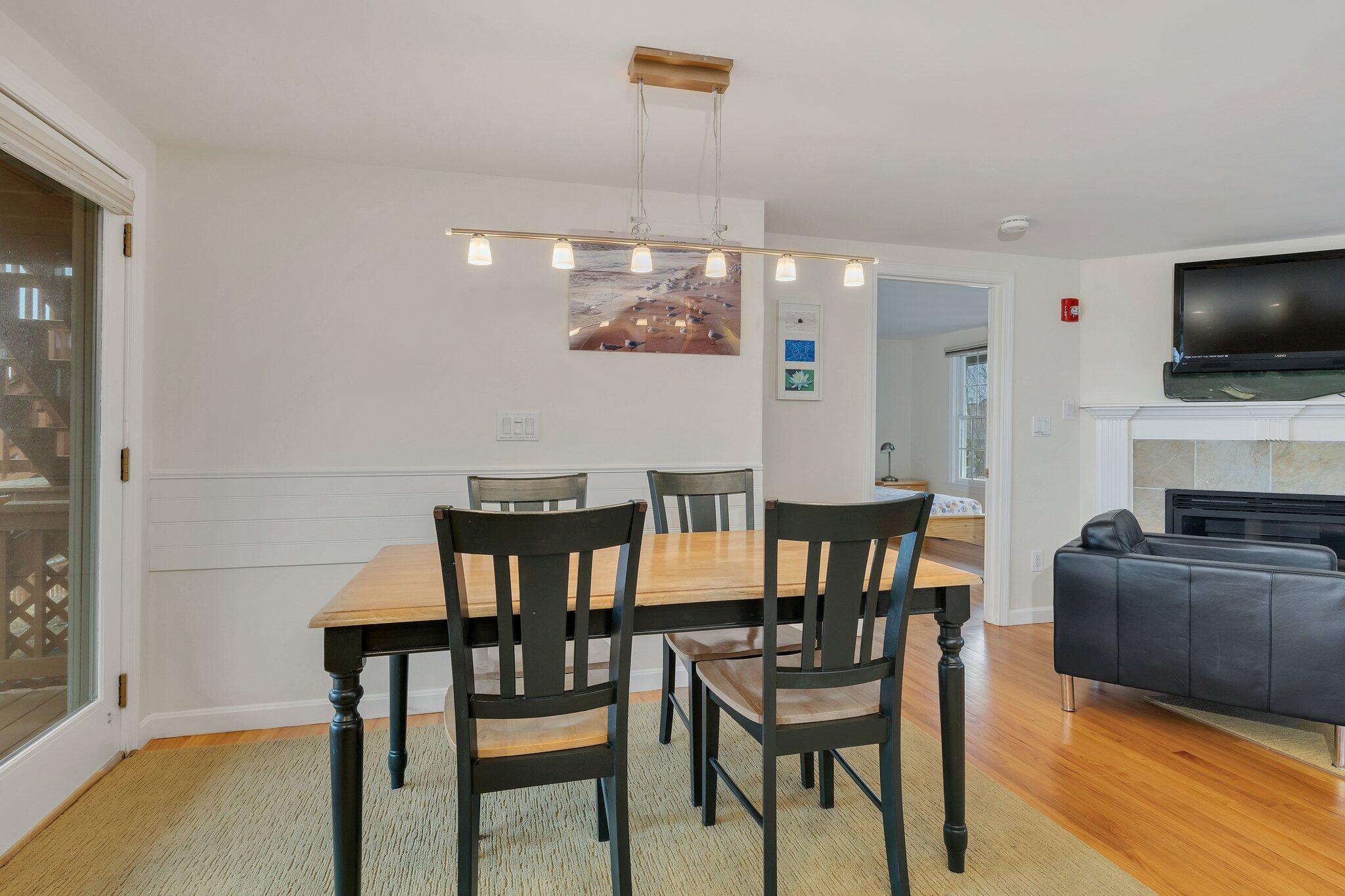 6 Shore Road, Unit 26 Truro, MA 02666 - Photo 8 of 25 a view of a dining room with furniture and wooden floor