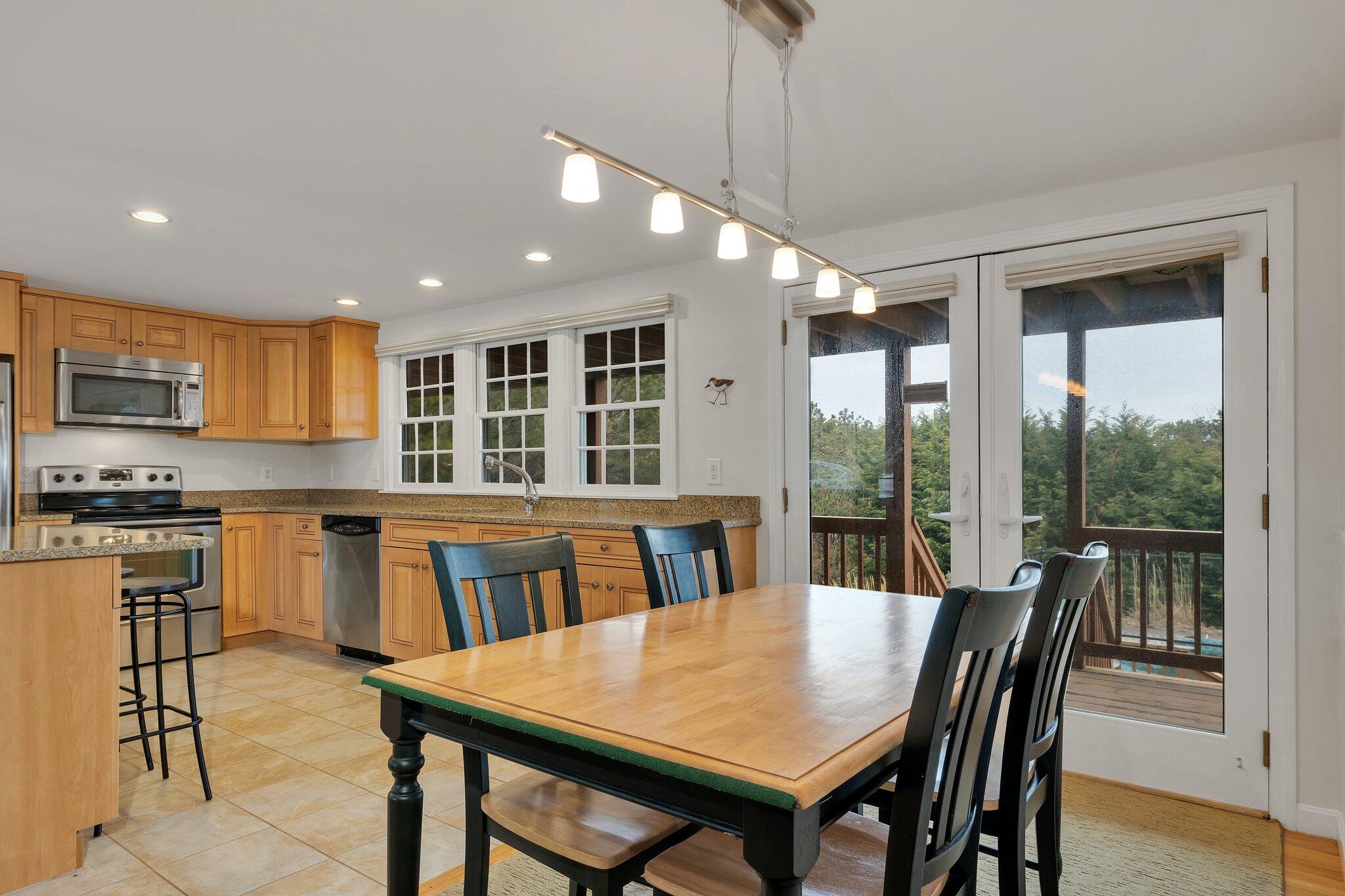 6 Shore Road, Unit 26 Truro, MA 02666 - Photo 10 of 25 a view of a dining room with furniture window and outside view